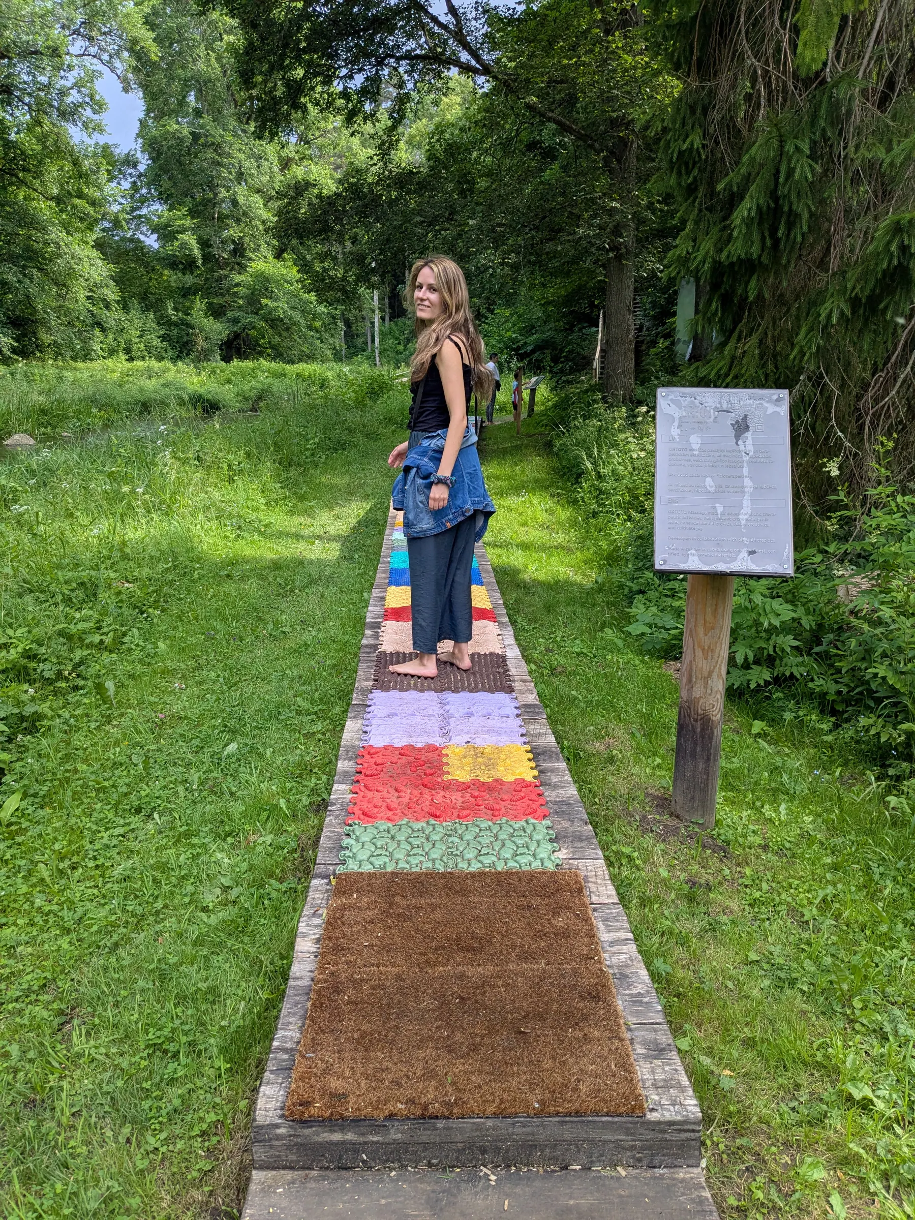 Acupressure foot mats laid out beside the barefoot trail