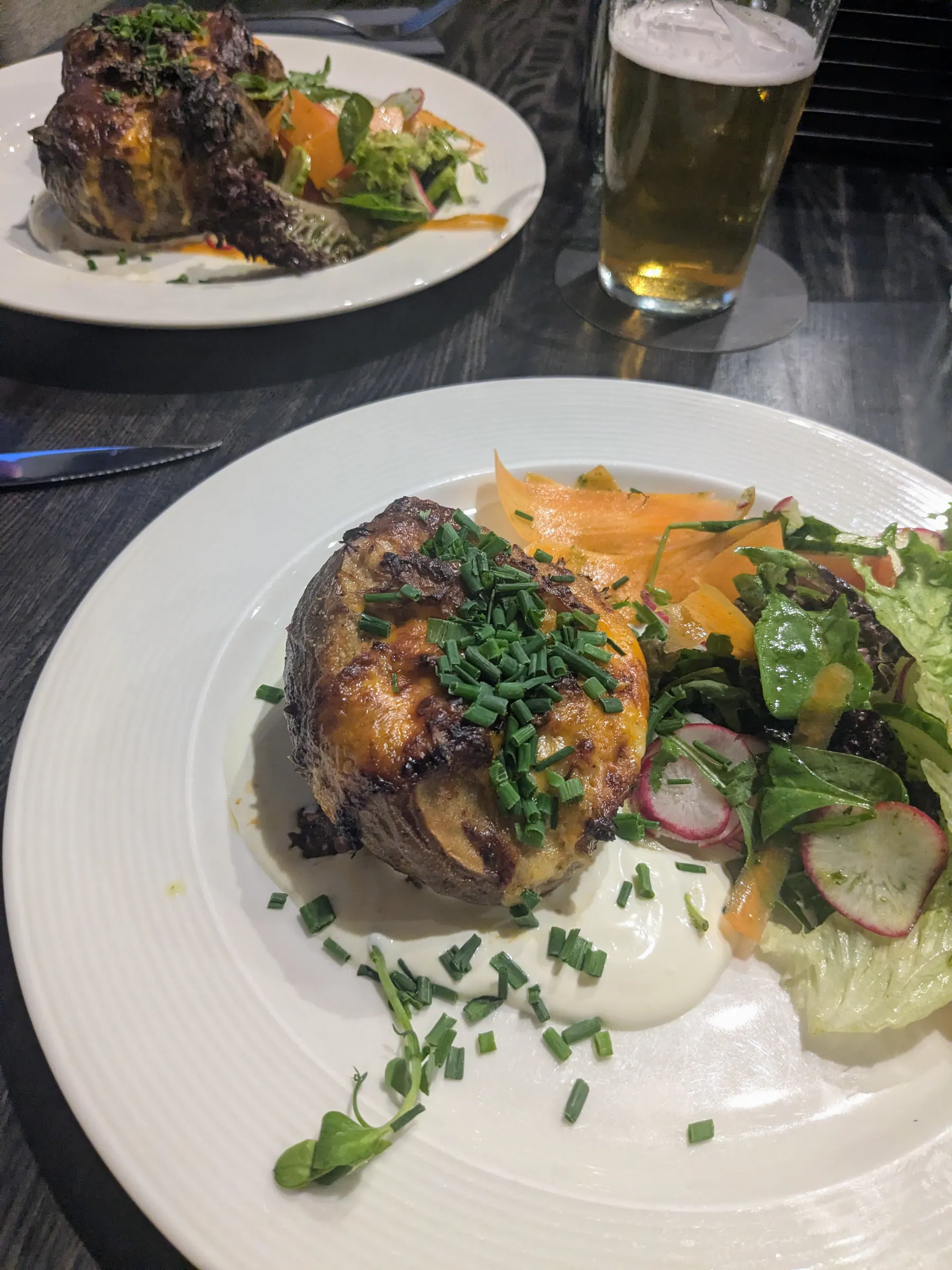 A stuffed potato served with salad at Hot Potato in Liepāja