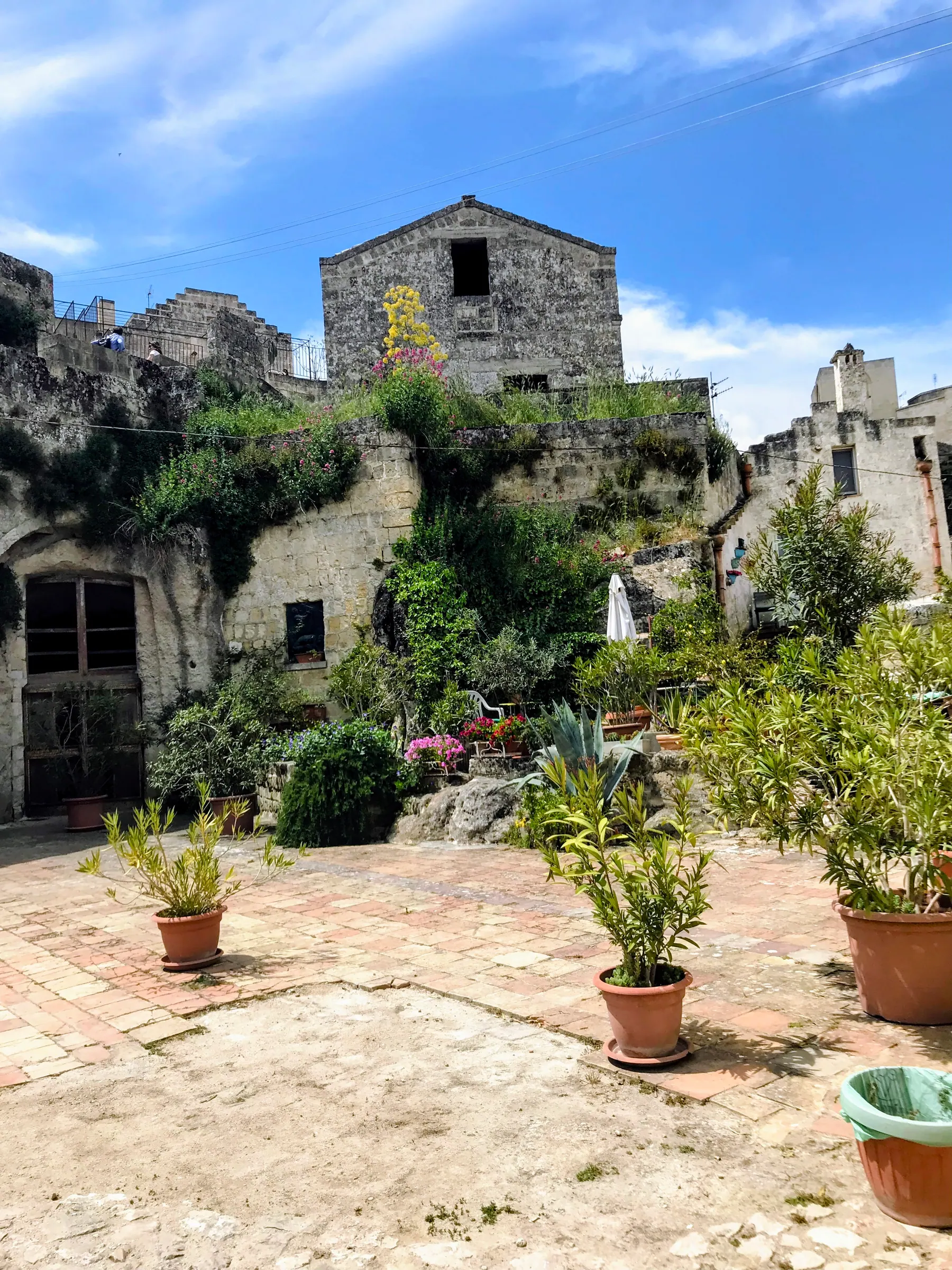 Cave homes and potted plants in Rione Malve