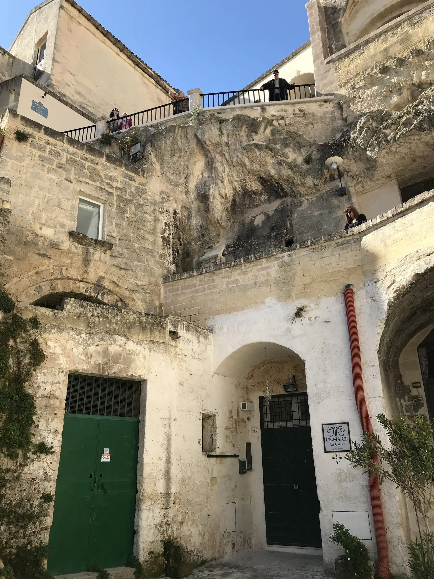 Rock-cut homes along a lane in Sasso Barisano