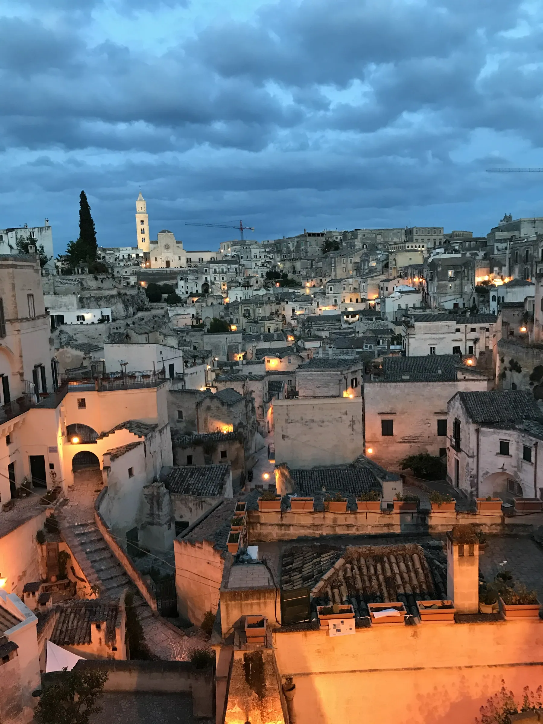 The Sassi in the evening under a dramatic sky