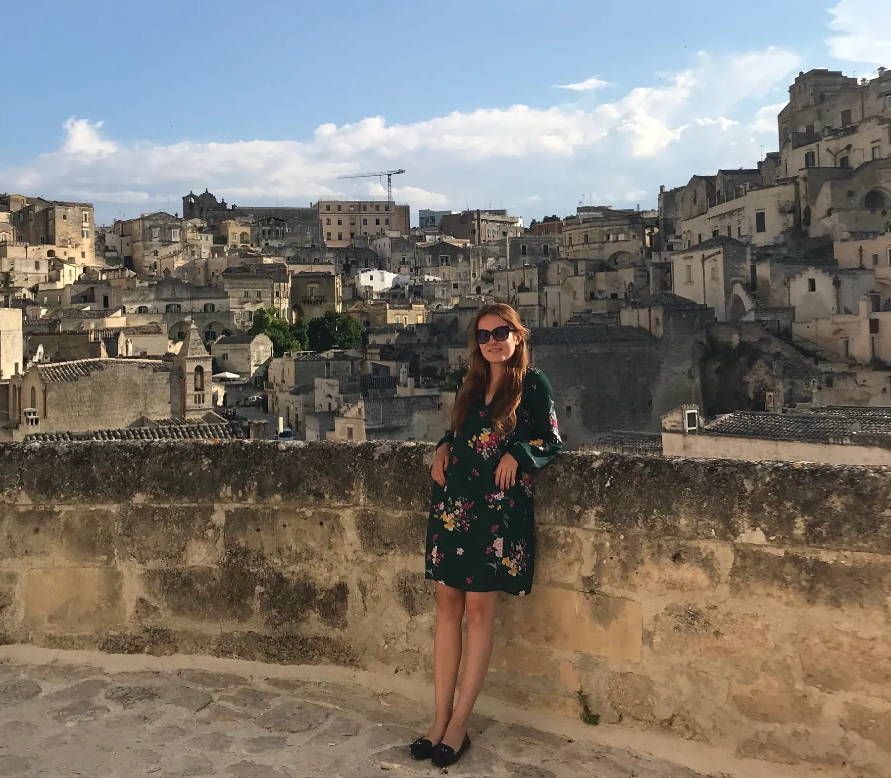 A traveler in a rock-cut passage in Matera