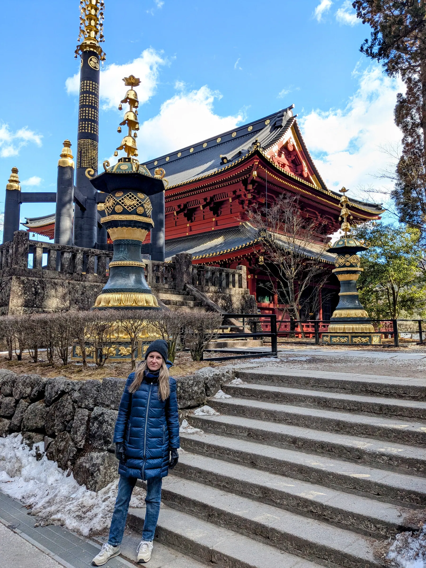 Ornate red and gold shrine buildings in Nikko's temple complex
